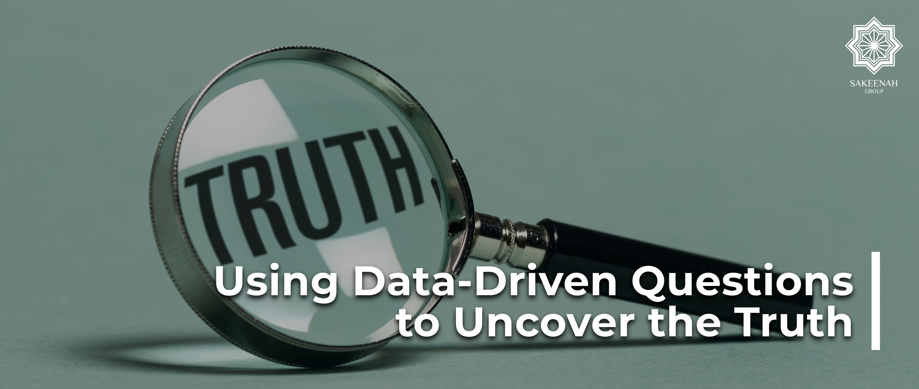 A magnifying glass with a black handle lies on a muted green surface, magnifying the word 'TRUTH' printed beneath its lens. Text overlaid on the bottom reads /Using Data-Driven Questions to Uncover the Truth,/ and the Sakeenah Group logo is visible in the upper right corner